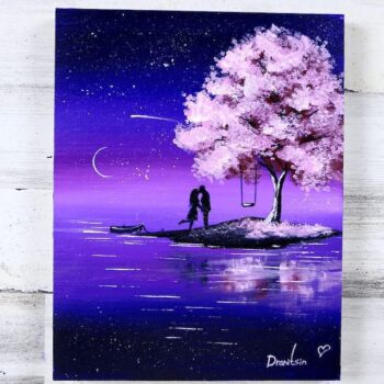 couple in love under blossom cherry tree